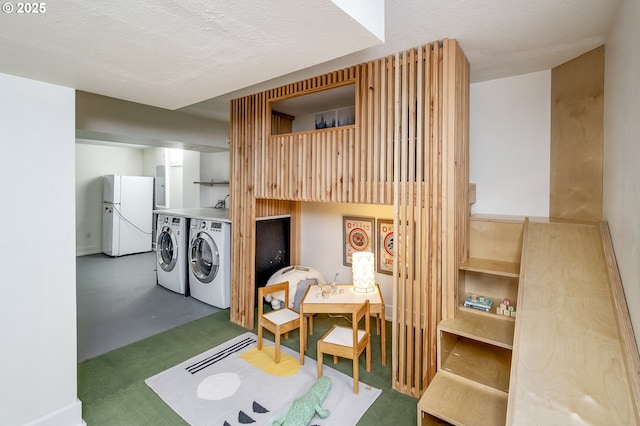 5835 NE 23rd Ave, Portland, OR 97211 - laundry room featuring independent washer and dryer and a textured ceiling