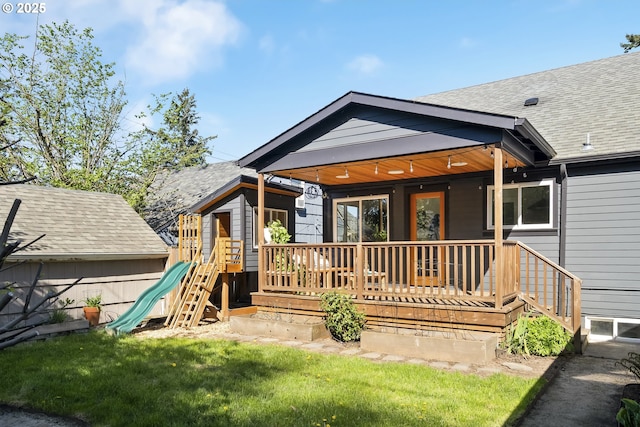 5835 NE 23rd Ave, Portland, OR 97211 - rear view of house with a lawn and a shingled roof
