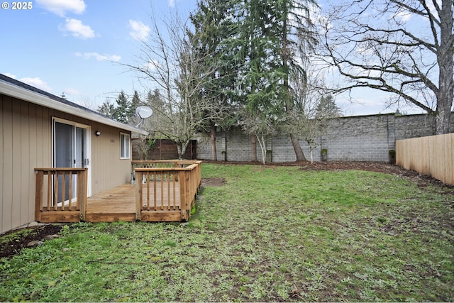 view of yard with a deck