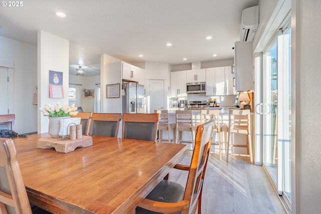 dining area featuring a wall mounted air conditioner