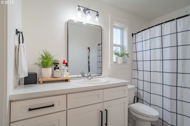 bathroom with vanity and toilet