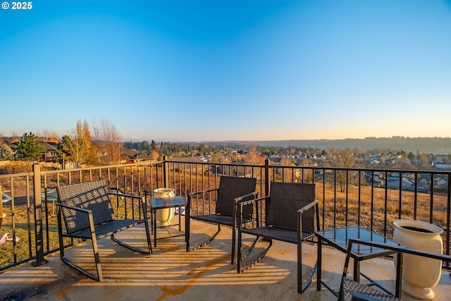 view of balcony at dusk