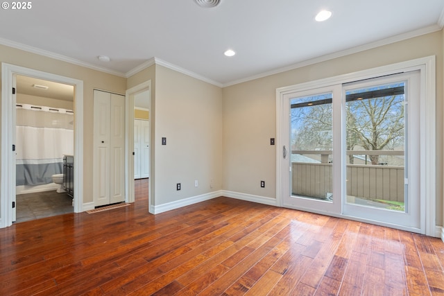 unfurnished bedroom with hardwood / wood-style floors, baseboards, ensuite bath, ornamental molding, and access to outside