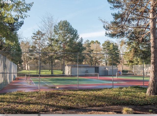 view of sport court featuring fence