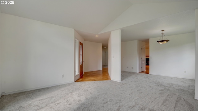 unfurnished room featuring high vaulted ceiling, recessed lighting, baseboards, and light carpet