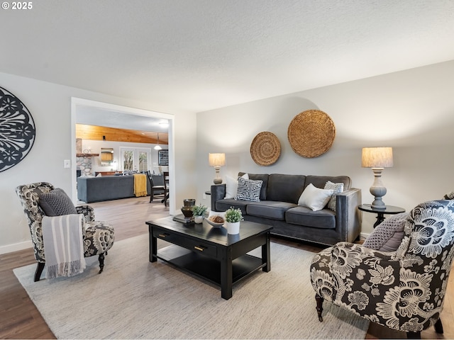 living room featuring french doors and hardwood / wood-style flooring