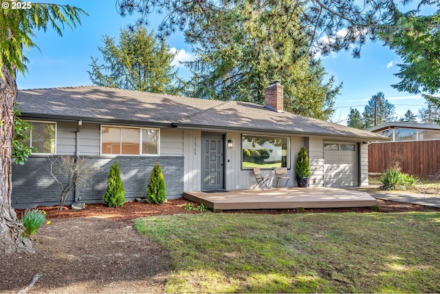 single story home featuring a front yard, an attached garage, fence, and a chimney