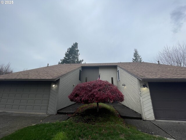 view of property exterior with a garage