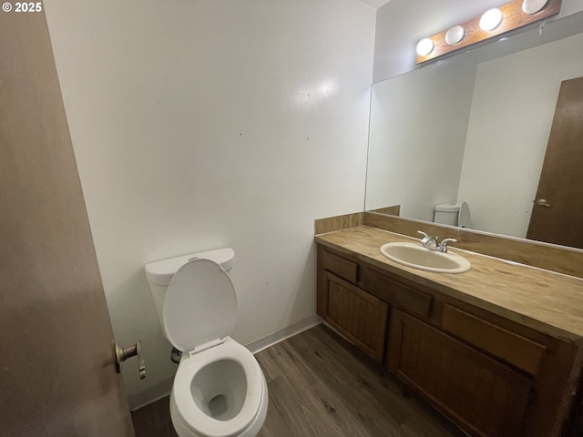 bathroom featuring wood-type flooring and vanity