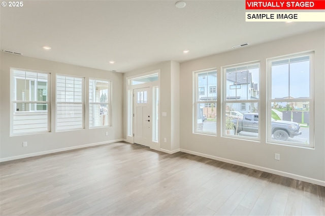 foyer with visible vents, recessed lighting, baseboards, and light wood-type flooring