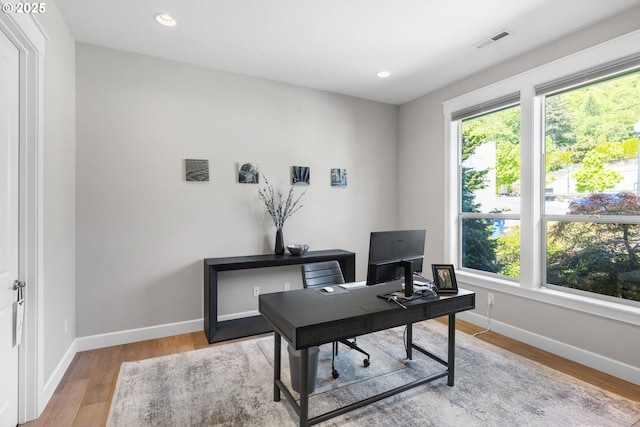 office area featuring visible vents, recessed lighting, light wood-style floors, and baseboards