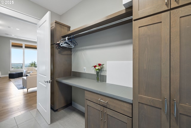 spacious closet with light tile patterned flooring