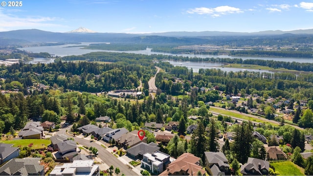 bird's eye view featuring a residential view and a water and mountain view