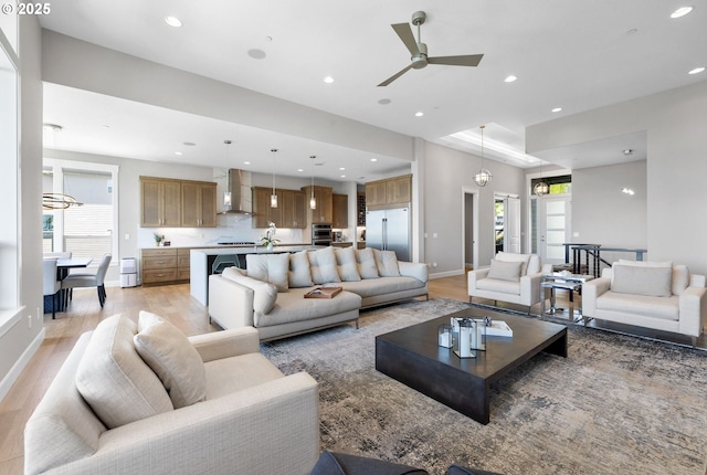 living room with recessed lighting, plenty of natural light, and light wood finished floors