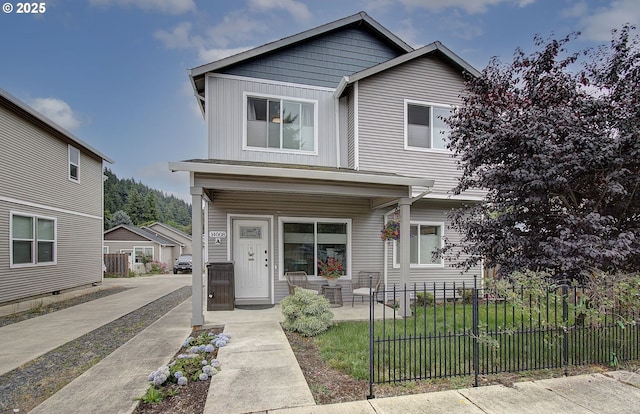 14008 SE Center St Unit A, Portland, OR 97236 - view of front of property with board and batten siding and covered porch
