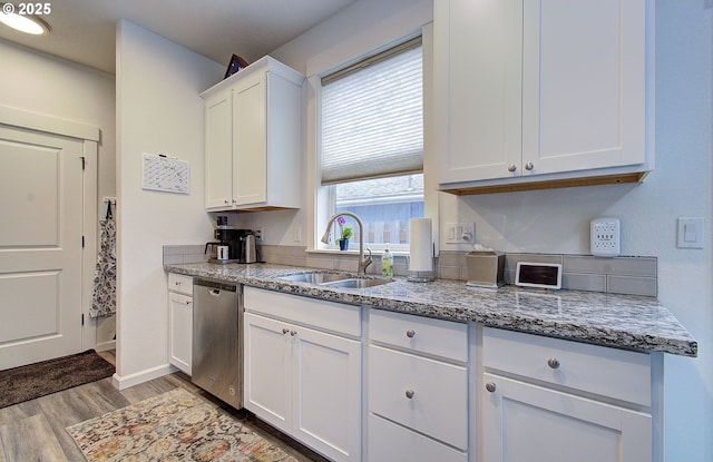 14008 SE Center St Unit A, Portland, OR 97236 - kitchen with dishwasher, light wood finished floors, white cabinets, and light stone counters