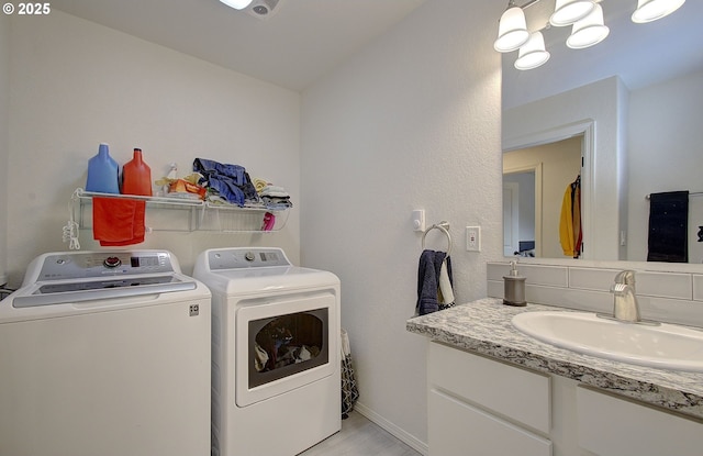 14008 SE Center St Unit A, Portland, OR 97236 - washroom with independent washer and dryer and light wood-style floors