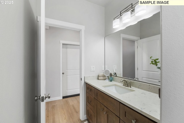 1197 NE Emerald Dr, Hermiston, OR 97838 - bathroom with wood finished floors and vanity
