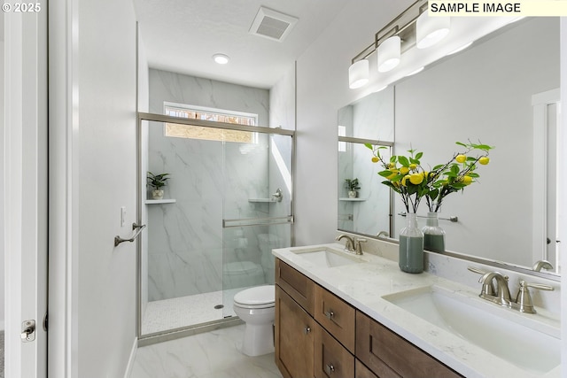 1197 NE Emerald Dr, Hermiston, OR 97838 - full bath featuring a marble finish shower, double vanity, and marble look tile flooring