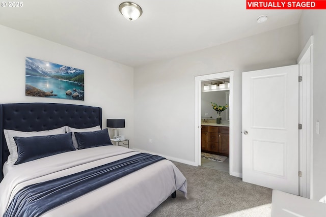 1197 NE Emerald Dr, Hermiston, OR 97838 - carpeted bedroom featuring ensuite bathroom and baseboards