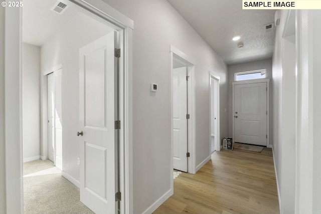 1197 NE Emerald Dr, Hermiston, OR 97838 - corridor featuring light wood-style flooring and recessed lighting