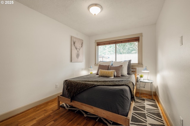 9334 N Lombard St Unit 7, Portland, OR 97203 - bedroom with baseboards and wood finished floors