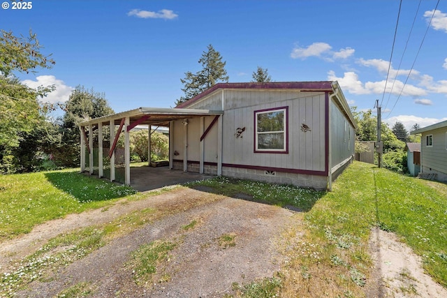 view of outbuilding featuring a carport