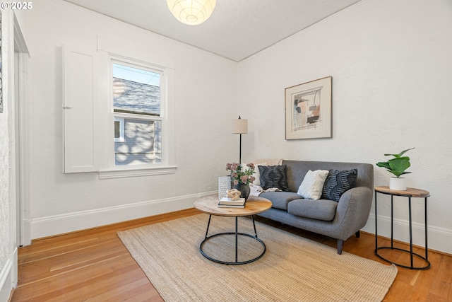 sitting room featuring baseboards and wood finished floors