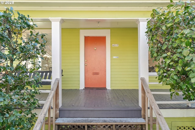 entrance to property with a porch