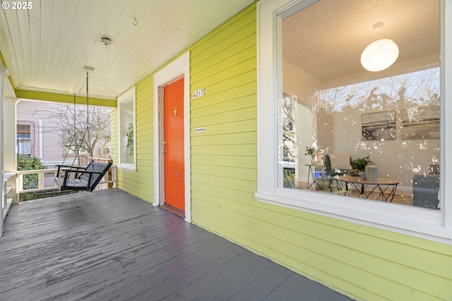 wooden terrace featuring a porch