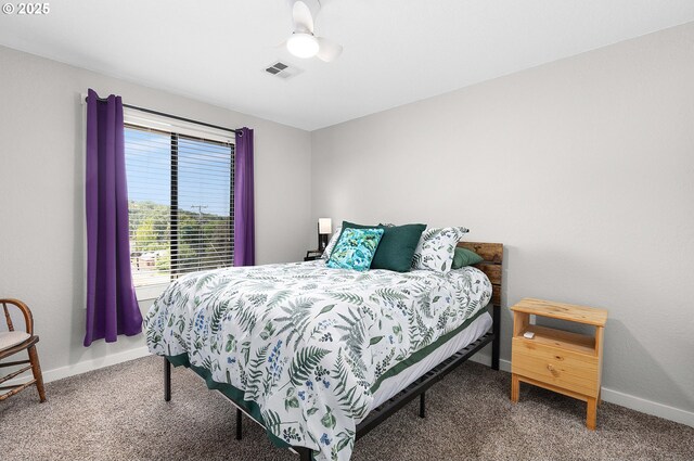 carpeted bedroom featuring baseboards and visible vents