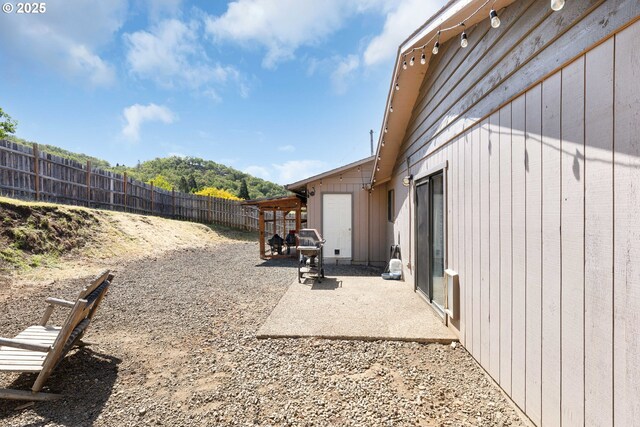 view of yard featuring a patio and a fenced backyard