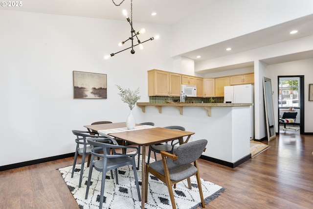 14426 SE Princeton Village Way, Clackamas, OR 97015 - dining room with a chandelier, dark wood finished floors, recessed lighting, and baseboards