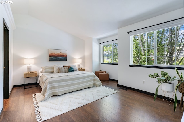 14426 SE Princeton Village Way, Clackamas, OR 97015 - bedroom featuring lofted ceiling, wood finished floors, and baseboards