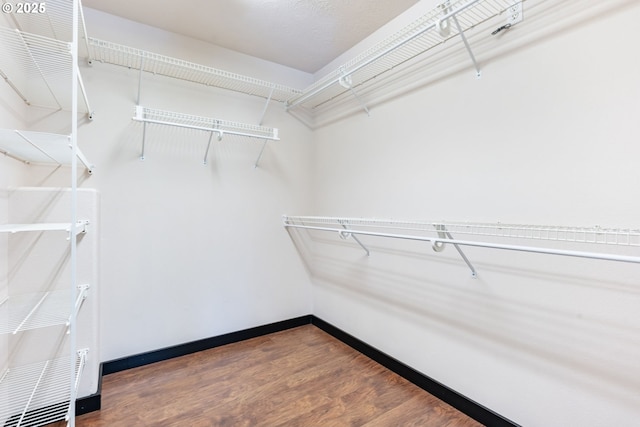 14426 SE Princeton Village Way, Clackamas, OR 97015 - walk in closet featuring wood finished floors