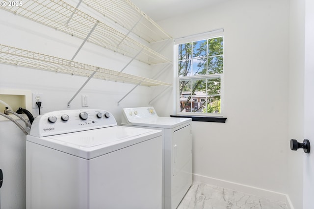14426 SE Princeton Village Way, Clackamas, OR 97015 - washroom featuring washer and dryer, baseboards, and light marble finish flooring
