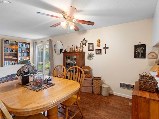 dining space featuring ceiling fan, wood finished floors, and baseboards