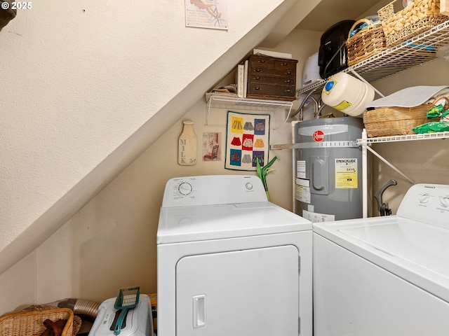 washroom featuring separate washer and dryer and secured water heater