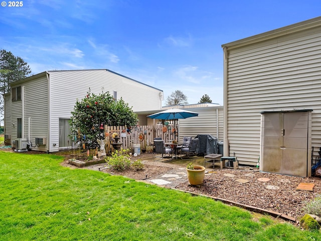 720 SE Rene Ave, Gresham, OR 97080 - rear view of house featuring a lawn and a patio area