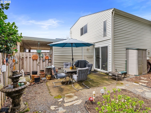 back of house with fence and a patio