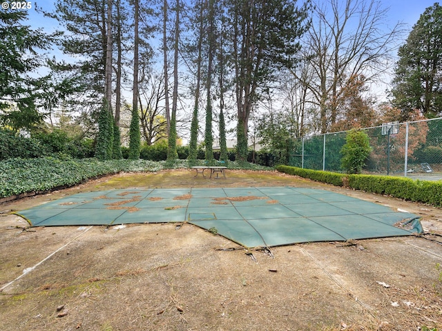 view of pool with fence and a patio
