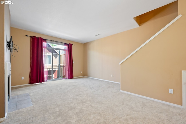 17047 SW Berkeley Ln, Beaverton, OR 97003 - unfurnished room featuring carpet flooring, baseboards, and a fireplace with flush hearth