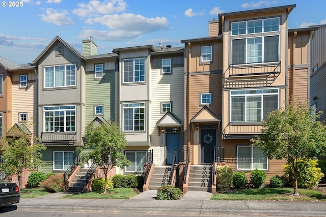 17047 SW Berkeley Ln, Beaverton, OR 97003 - townhome / multi-family property featuring a chimney