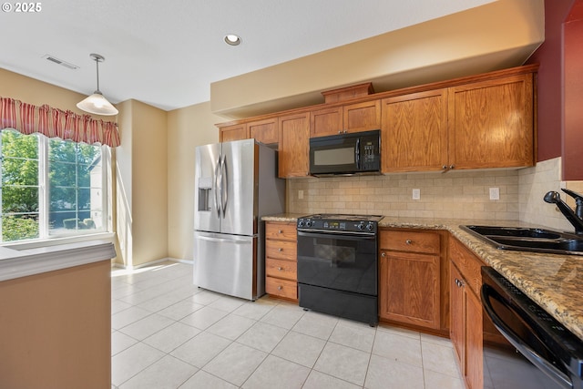 17047 SW Berkeley Ln, Beaverton, OR 97003 - kitchen featuring black appliances, a sink, brown cabinetry, decorative backsplash, and recessed lighting