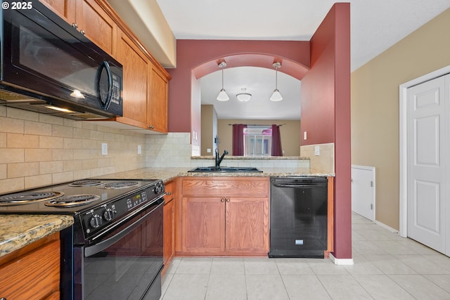 17047 SW Berkeley Ln, Beaverton, OR 97003 - kitchen featuring black appliances, a sink, tasteful backsplash, light stone counters, and light tile patterned flooring