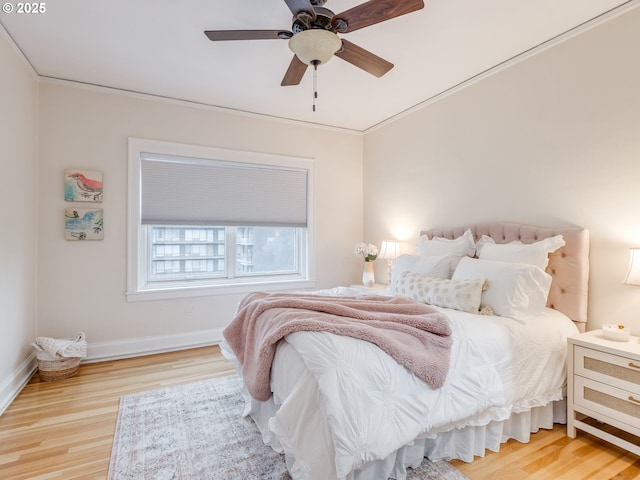 2015 NW Flanders St Unit 511, Portland, OR 97209 - bedroom featuring wood finished floors, baseboards, and ceiling fan