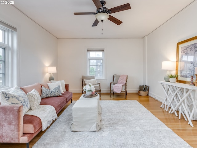 2015 NW Flanders St Unit 511, Portland, OR 97209 - living area with wood finished floors, ceiling fan, and baseboards