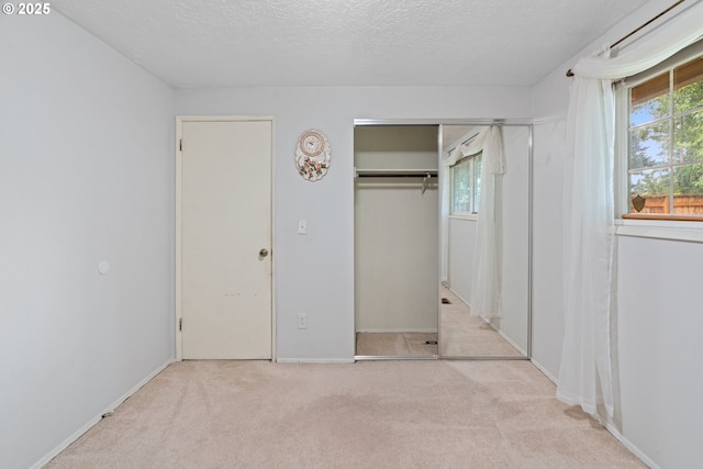 5715 SW 191st Ave, Beaverton, OR 97078 - unfurnished bedroom with carpet flooring, a closet, and a textured ceiling