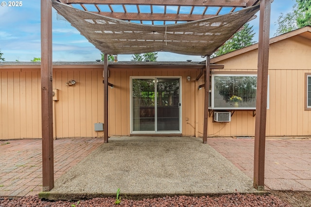 5715 SW 191st Ave, Beaverton, OR 97078 - doorway to property with a patio area, a pergola, and a wall mounted air conditioner