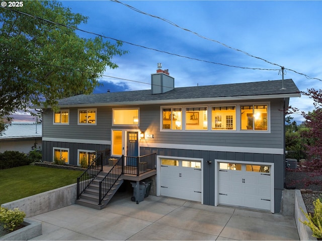 99 Walnut St, La Grande, OR 97850 - view of front of property featuring an attached garage, driveway, a front lawn, a chimney, and a shingled roof